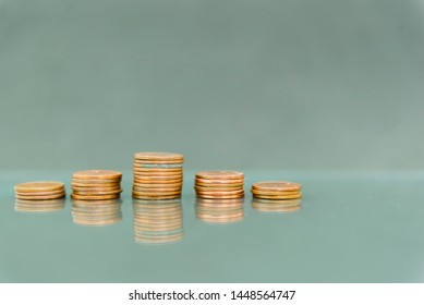 One cent stacks on the surface of the mirror, income graph.