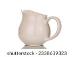 One ceramic jug, macro, isolated on white background.