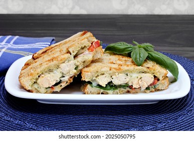 One Chicken, Cheese, Basil, Spinach, And Pesto Panini Sandwich.

