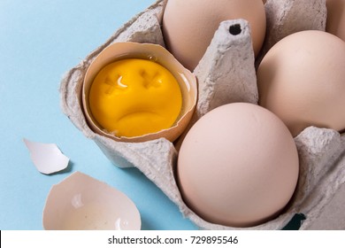 One Chicken Egg Is Broken And The Yolk Is Sad Or Dead. Rotten Egg