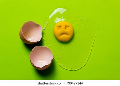 One Chicken Egg Is Broken And The Yolk Is Sad Or Dead. Rotten Egg