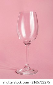 One Clean Empty Wineglass On Pink Background