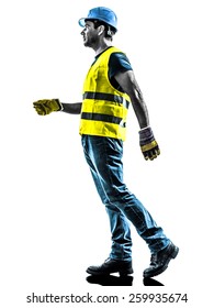 One Construction Worker Walking With Safety Vest Silhouette Isolated In White Background