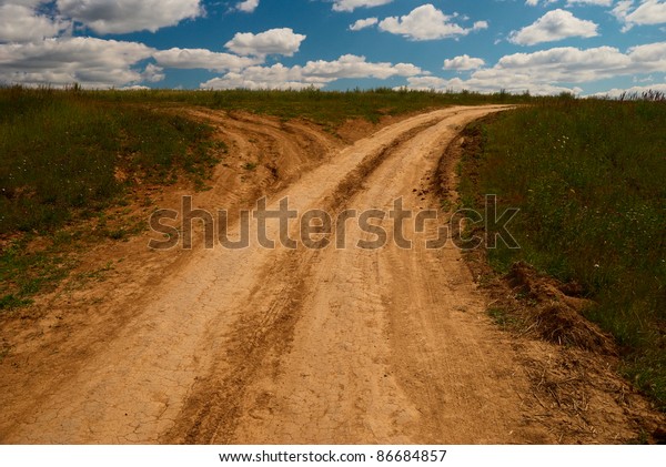 One country road\
divides into two roads