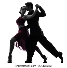 one  couple man woman ballroom dancers tangoing in silhouette studio isolated on white background