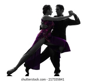 one  couple man woman ballroom dancers tangoing in silhouette studio isolated on white background