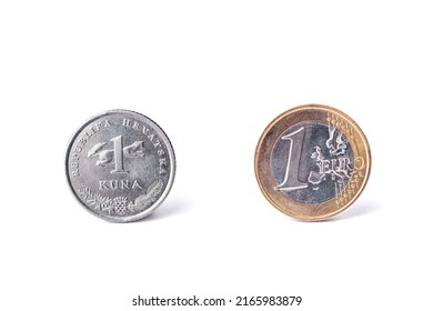 One croatian kuna coin and one Euro coin detailed studio shot.