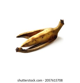 One Dark Rotten Banana Peel Left On A White Background, Isolated.