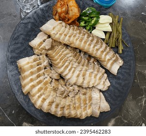 One day of home cooking, cooking Korean food Bossam. Bossam is cooked with pork. - Shutterstock ID 2395462283