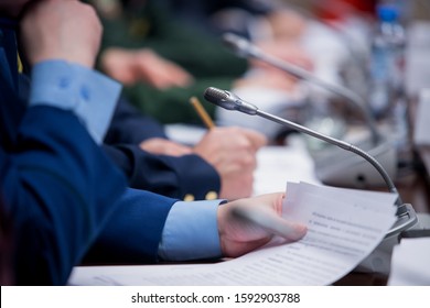 One of delegates asking or answering question at political summit or conference - Shutterstock ID 1592903788