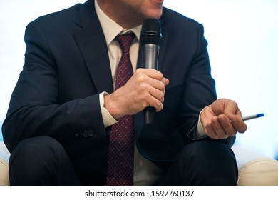 One of delegates asking or answering question at political summit or conference - Shutterstock ID 1597760137