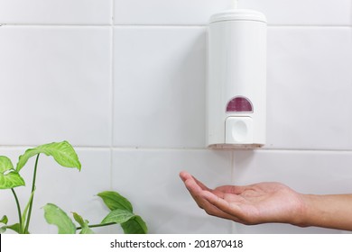 one dirty hand under the hand wash-Automatic soap dispenser - Shutterstock ID 201870418