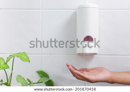 one dirty hand under the hand wash-Automatic soap dispenser