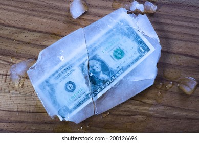 One Dollar Bill Frozen And Broken In Ice And Money Rended.