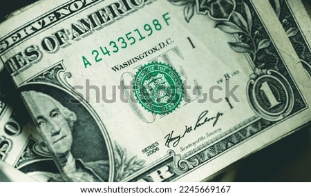 One dollar bills in close-up photo. Economy and finance.
