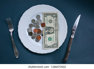 One Dollar Lying On The Plate With Fork And Knife. No Money Photo. Poor People Idea. Dimes And Cents Coins. Small Salary And Pension Not Enough For Food. Social Problems.