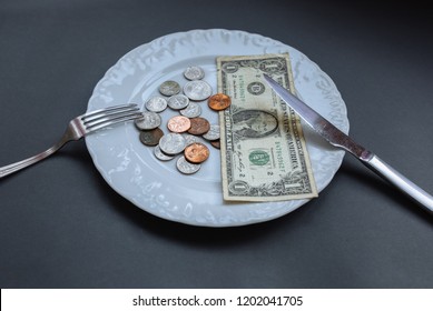 One Dollar Lying On The Plate With Fork And Knife. No Money Photo. Poor People Idea. Dimes And Cents Coins. Small Salary And Pension Not Enough For Food. Social Problems.