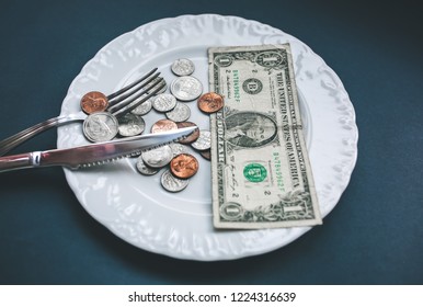 One Dollar Lying On The Plate With Fork And Knife. No Money Photo. Poor People Idea. Dimes And Cents Coins. Small Salary And Pension Not Enough For Food. Social Problems.