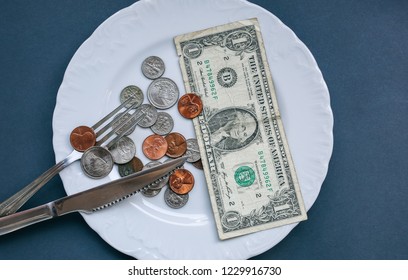 One Dollar Lying On The Plate With Fork And Knife. No Money Photo. Poor People Idea. Dimes And Cents Coins. Small Salary And Pension Not Enough For Food. Social Problems.