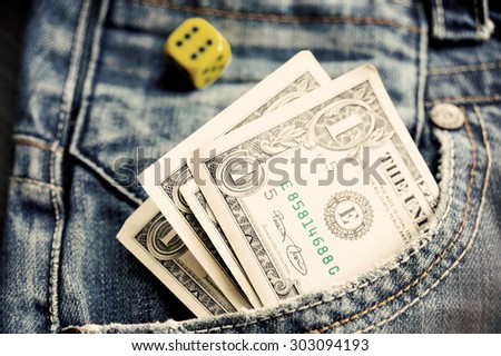 One dollar in pocket denim and a dice retro vintage toned
