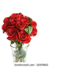 One Dozen Beautiful Red Roses In A Vase, On A White Background With Space For Copy.