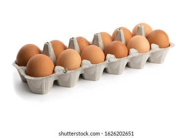 one dozen brown eggs in a cardboard egg carton isolated on white