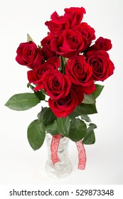 One Dozen Roses In Glass Vase.