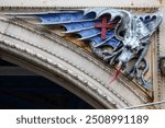 One of the dragon sculptures on the exterior of the building that houses Smithfield market in London, UK.  The dragon is symbolic of the City of London.