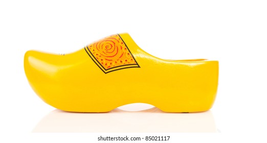 One Dutch yellow wooden shoe over white background