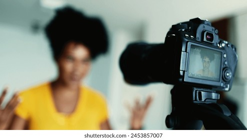 One Dynamic 20s Black Woman Recording Testimonial Video, Engaging Online Audience as a New Media Vlogger - Powered by Shutterstock