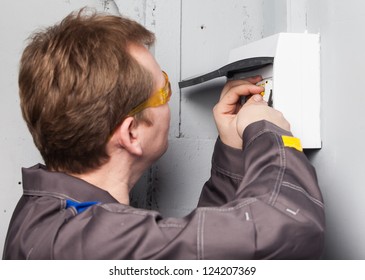 One Electrician Examining Fuse Box