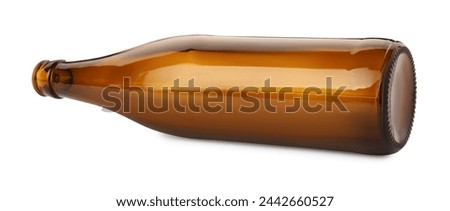 One empty brown beer bottle isolated on white