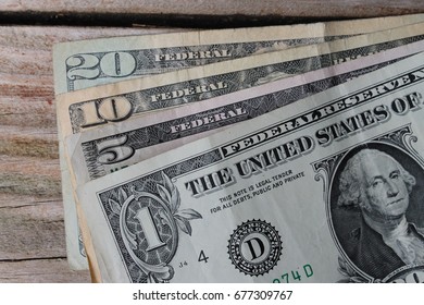 one, five, ten and twenty dollar bills - Shutterstock ID 677309767