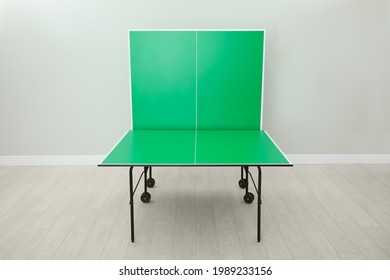 One Folding Green Ping Pong Table Indoors