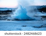 one geyser among many in Iceland, in winter, under snow and ice
