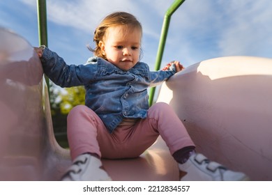 One Girl Small Caucasian Child Female Toddler 18 Months Old Having Fun In Park On The Slide In Day Childhood And Growing Up Concept Copy Space