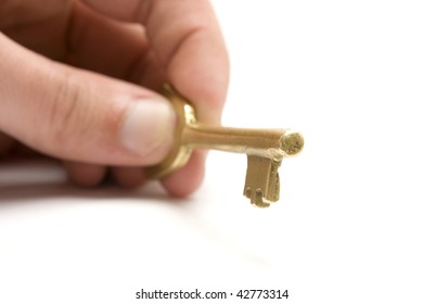 One golden and old key isolated on white background