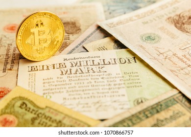 One Golden Shiny Bitcoincoin Stands On Ancient Paper Money. Cash Inflation 1923, One Million Marks Is Valueless. Cryptocurrency, Blockchain And Finance Concept Background. Close-up, Copy Space.