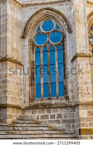 One of the Gothic stone windows of the apse of Palencia Cathedral, Spain.