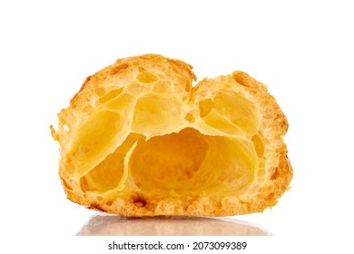 One half of a fragrant Chouquette on in a glass dish, close-up, isolated on white.