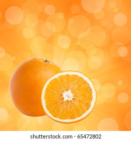 One and half oranges on abstract bokeh background
