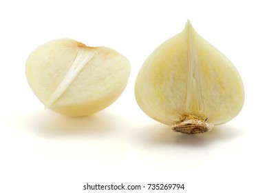 One halved solo garlic isolated on white background two halves - Shutterstock ID 735269794