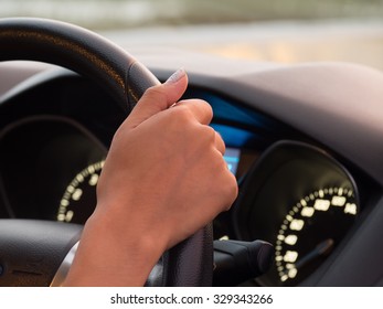 One hand driving car showing meters
