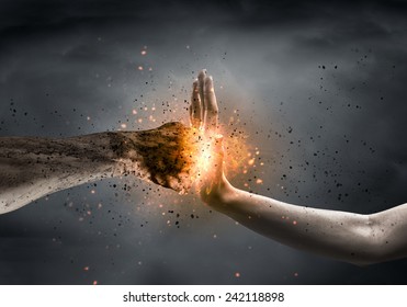 One hand preventing punch attack of another hand - Shutterstock ID 242118898