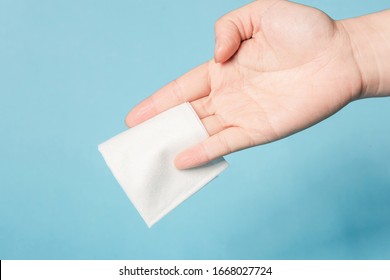 One hand is testing the tenacity of a tissue - Shutterstock ID 1668027724