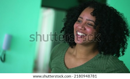 One happy black woman spontaneous laugh and smile
