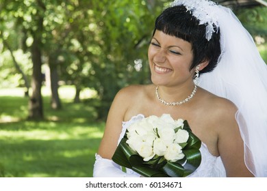 One happy bride outdoors.