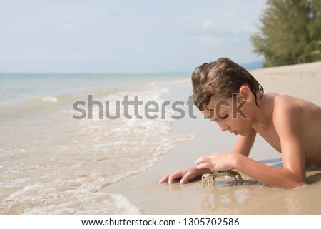 Similar – One happy little boy playing on the beach