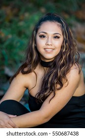 One Hawaiian Pacific Islander Girl Poses For High School Senior Portrait