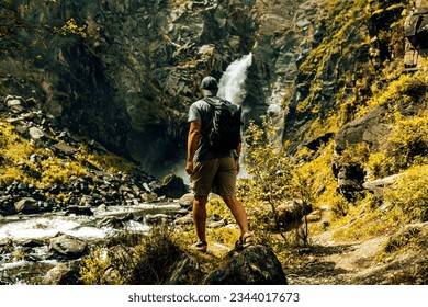 one hiker person hiking in the mountains  - Powered by Shutterstock